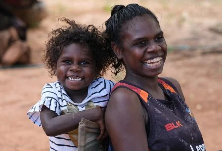 Maningrida-mother-daughter-laughing-450x306